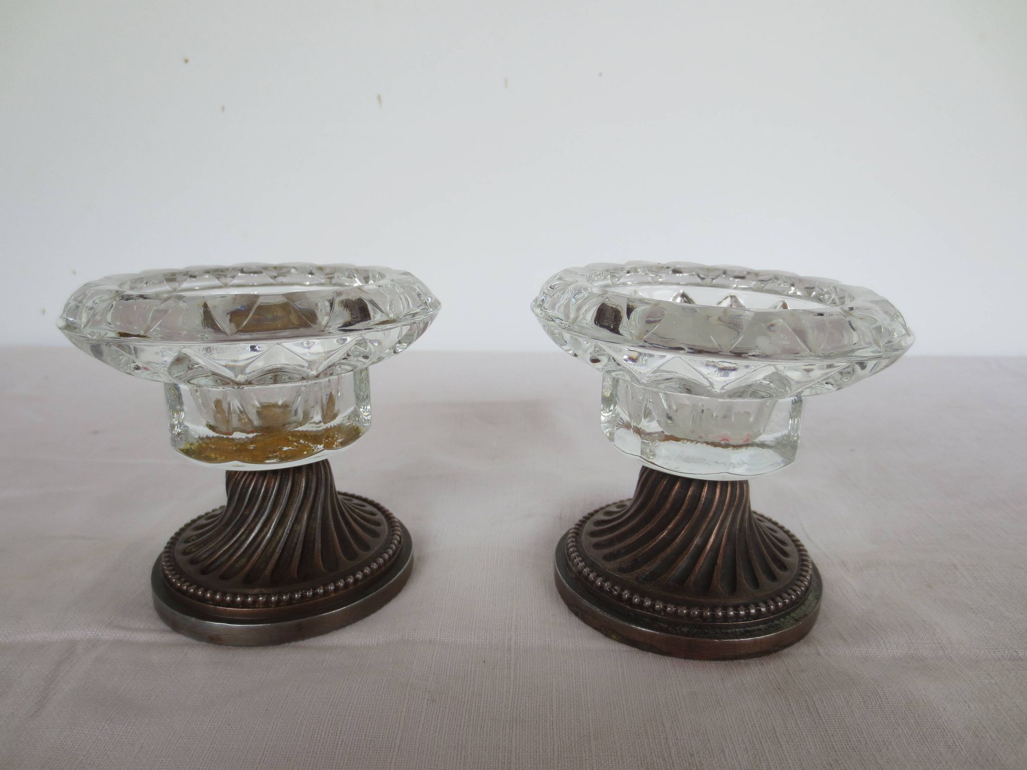 Two candle holders in bronze and crystal