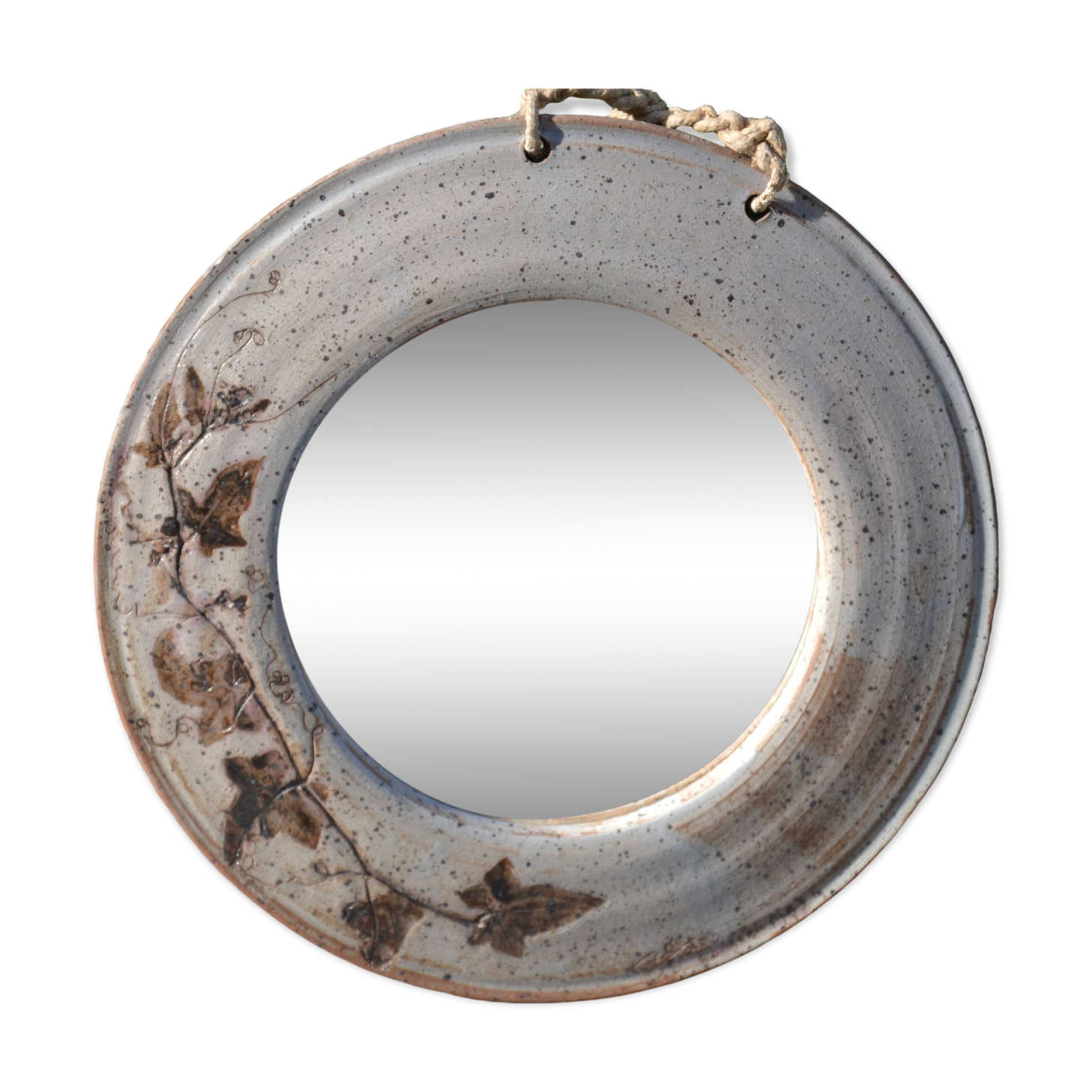 Round ceramic mirror signed