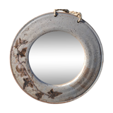 Round ceramic mirror signed