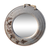 Round ceramic mirror signed