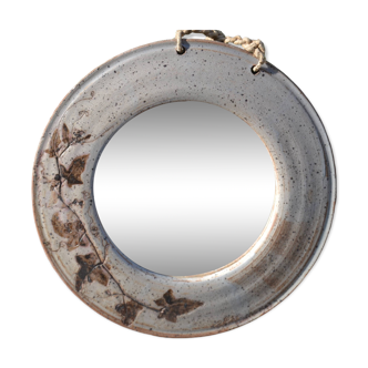 Round ceramic mirror signed