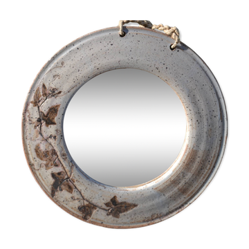 Round ceramic mirror signed