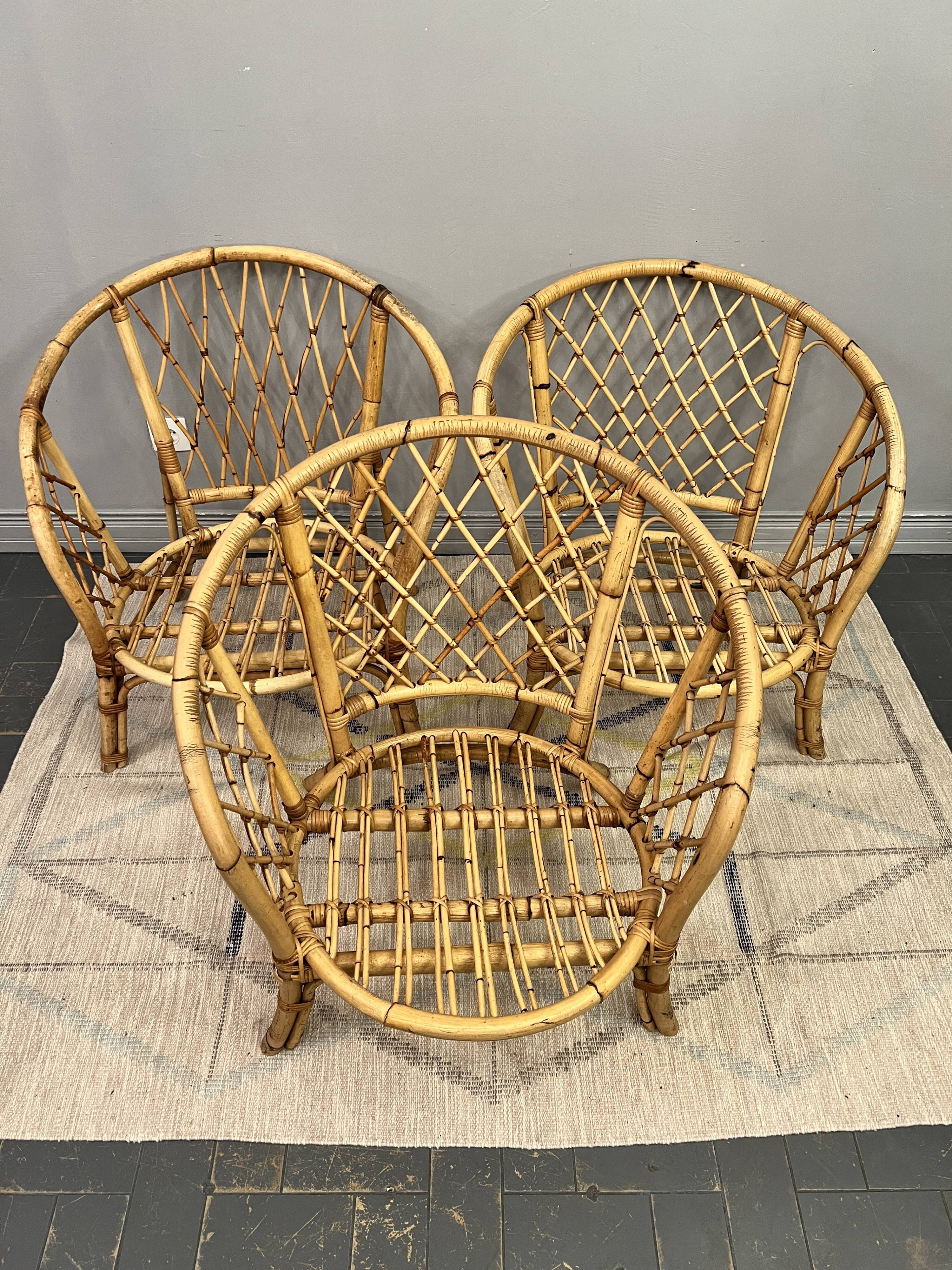 Trio of rattan armchairs
