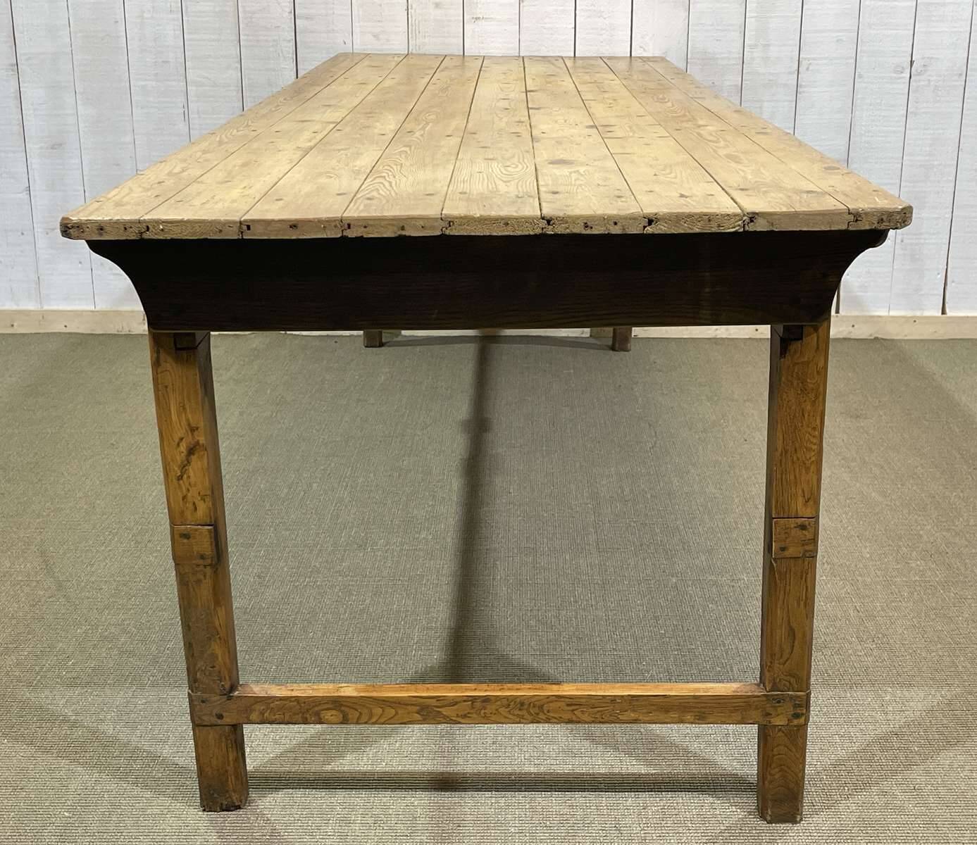 Early 20th-century farmhouse table made of fir, elm, and chestnut.