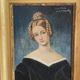 Portrait of young woman painting on wood