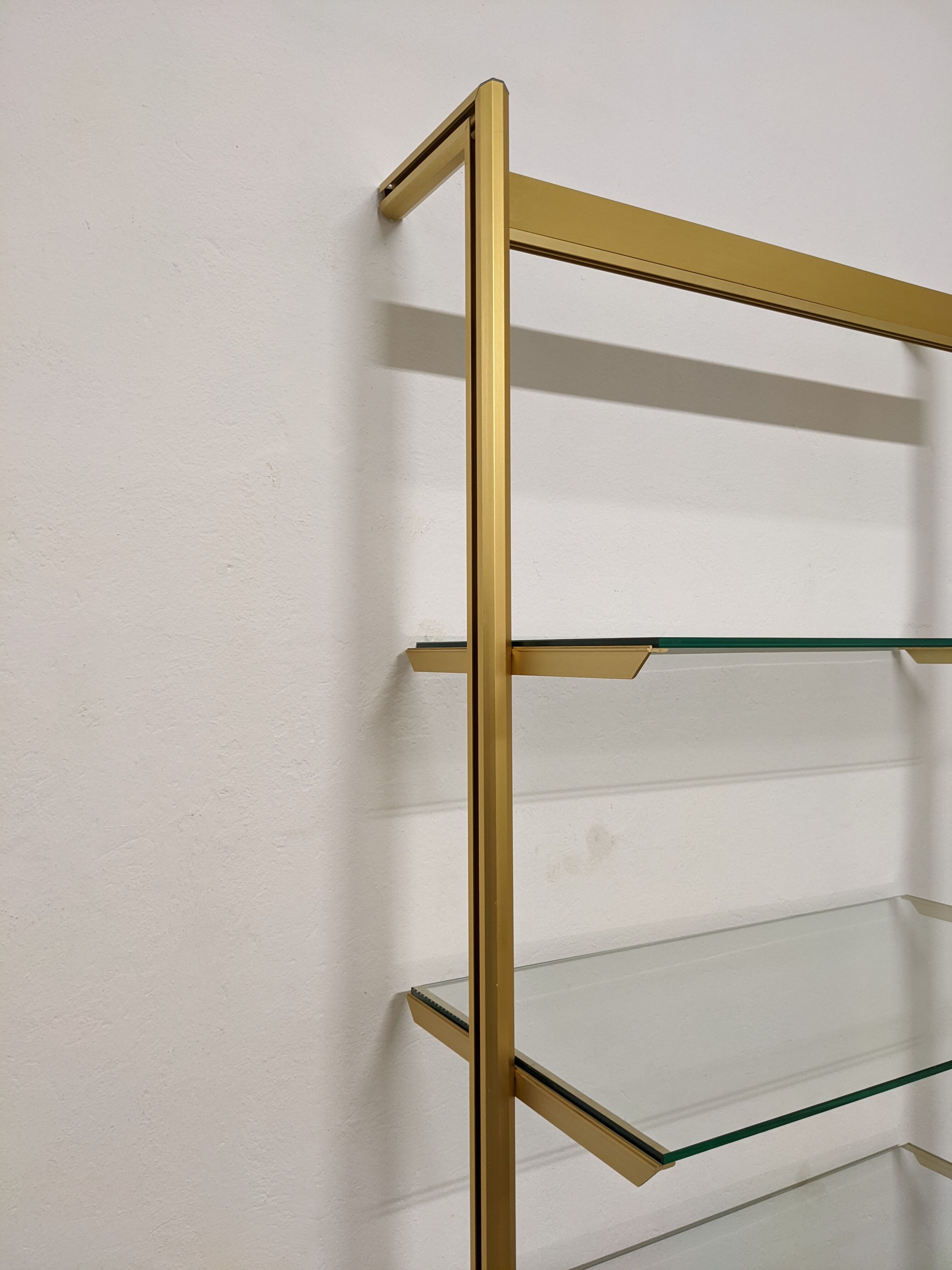 Modular shelf in glass and gilded aluminum from the 70-80s
