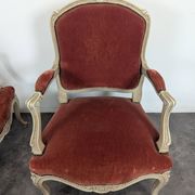 Pair of red cabriolet armchairs in Louis XV style