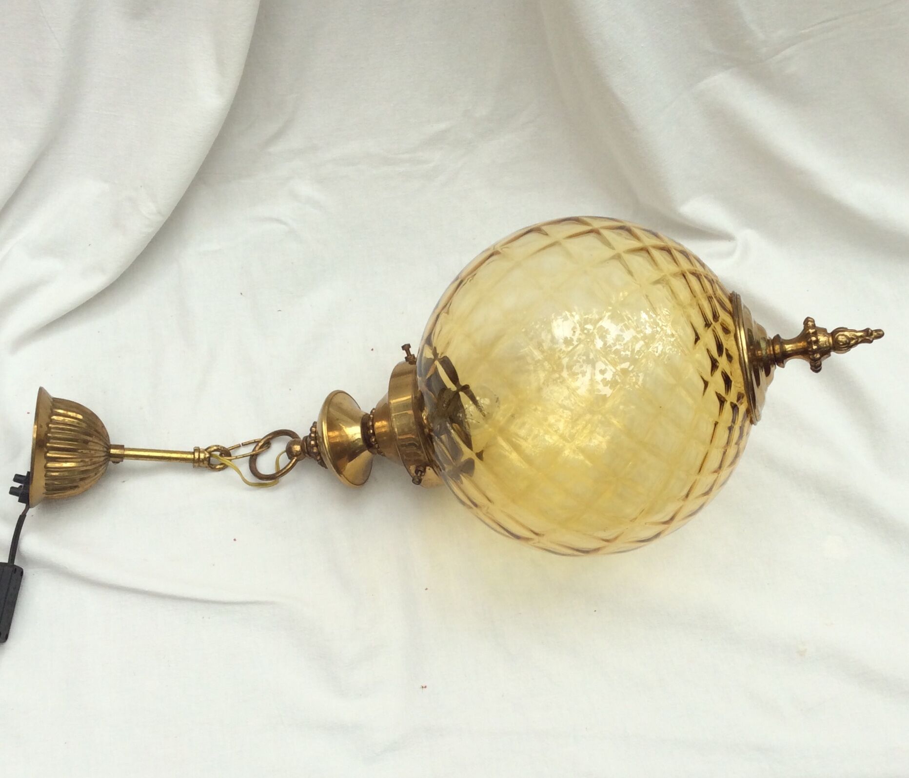 Amber glass suspension with brass