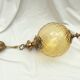 Amber glass suspension with brass