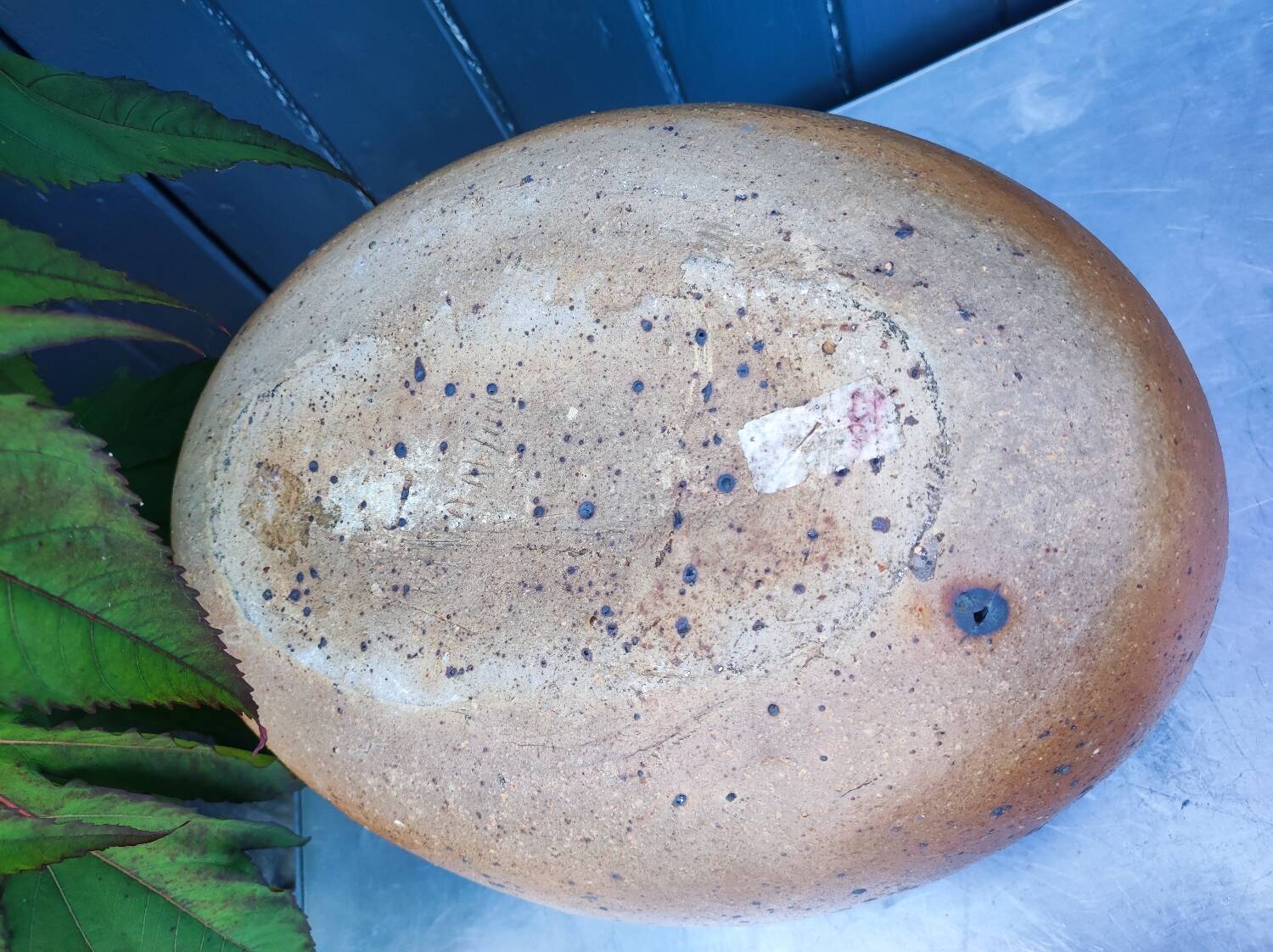 Vintage sandstone vase, in the shape of a rugby ball, signed