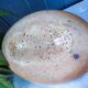 Vintage sandstone vase, in the shape of a rugby ball, signed