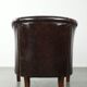 Dark cow leather club armchair in good condition with an English design