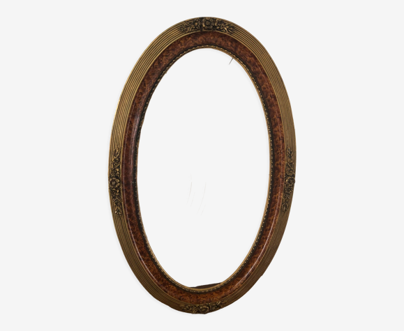 Ancien cadre ovale bois et stuc doré motifs floraux