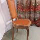 Caned chair in Louis XV style painted orange.