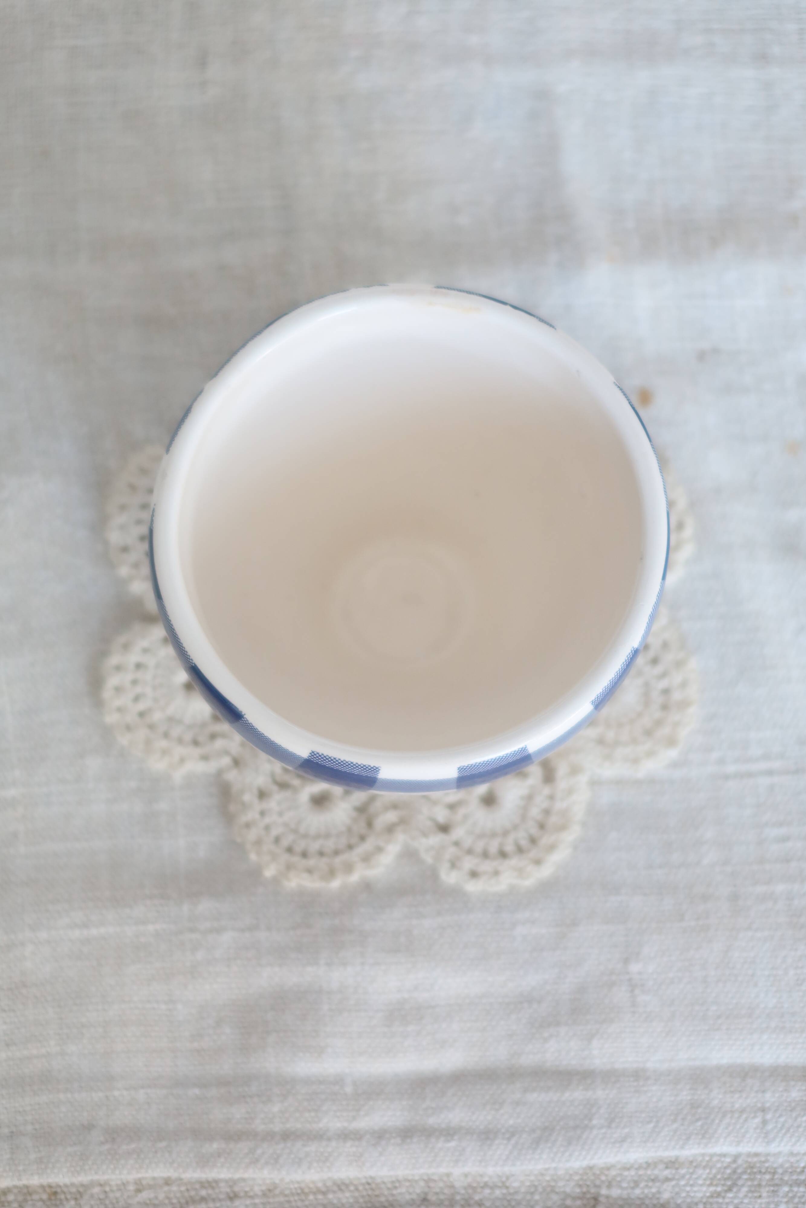 Small vintage white earthenware bowl with blue gingham pattern