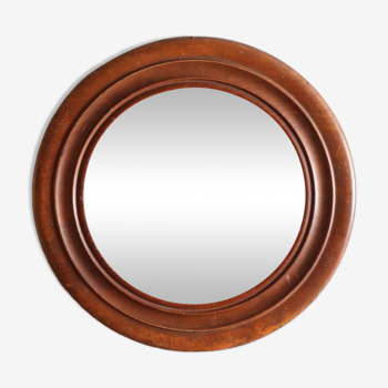 Round old wooden mirror