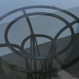 Wrought iron dining table with its round smoked glass top, vintage 1980