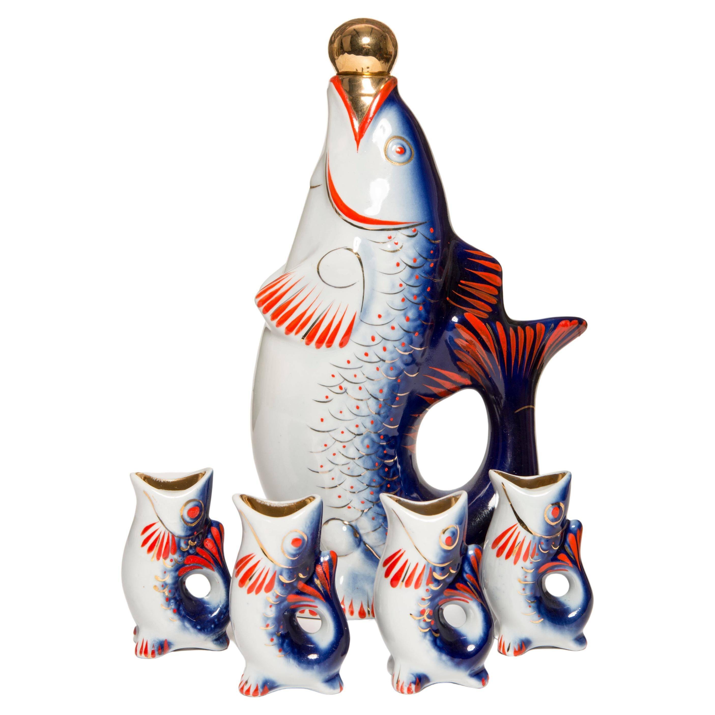 Set of 7 glasses and a glass carafe decorated with blue fish, Mid-Century Modern style, Europe, 1960s.