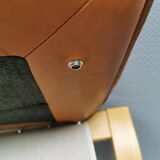 Folding Stool, in light beech wood with cognac colored leather cushion.