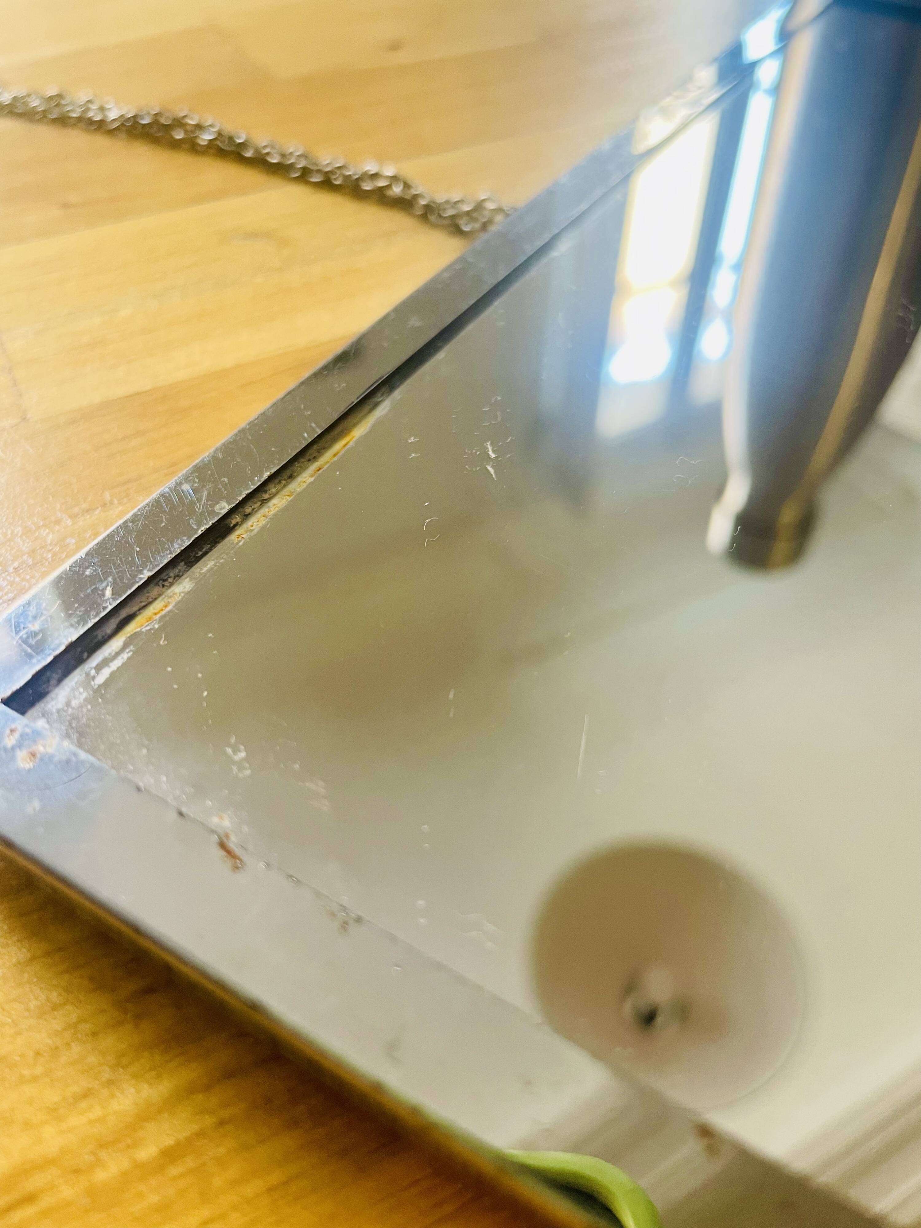 Barber mirror with chrome metal surround