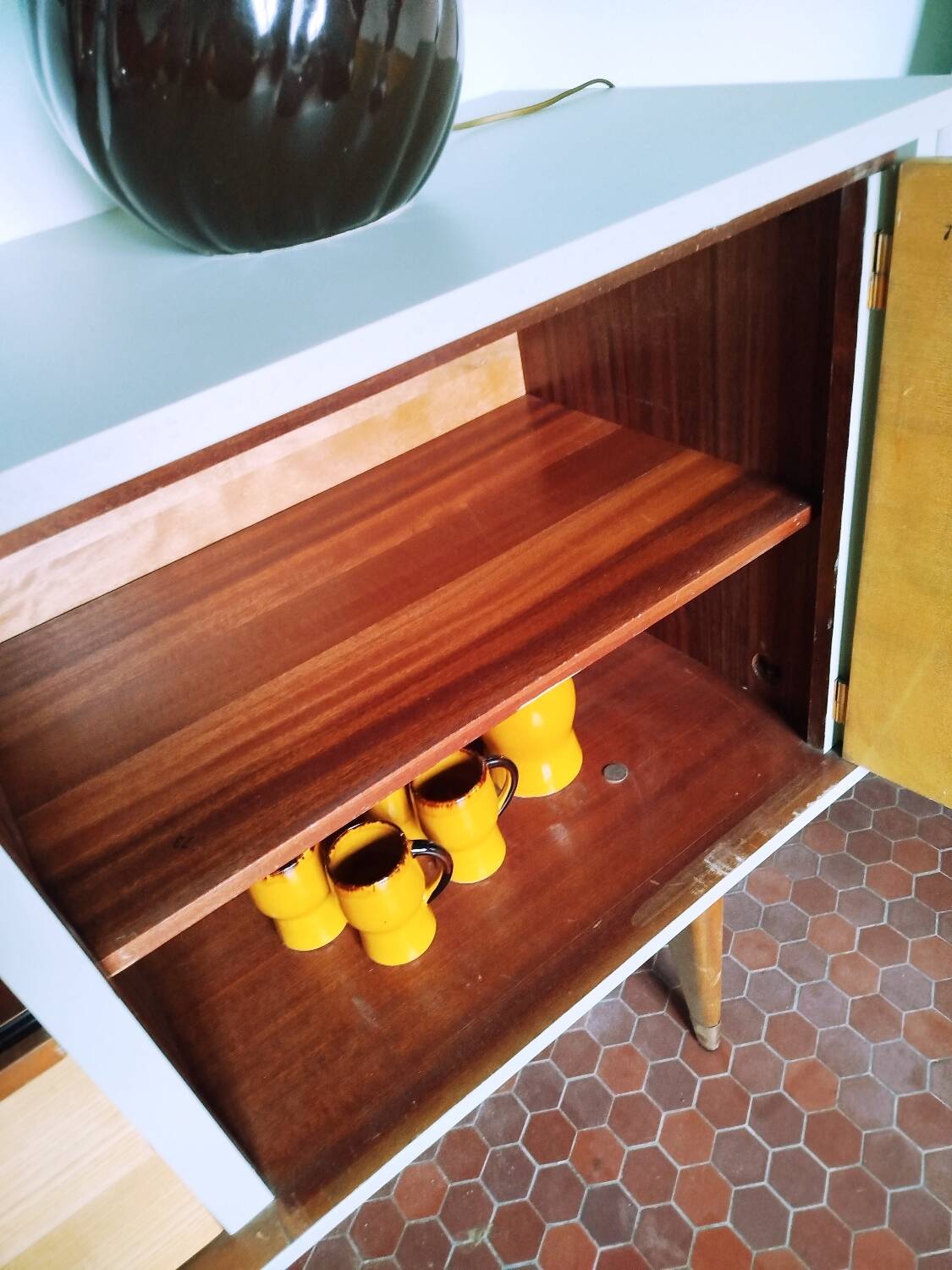 Wooden sideboard in soft green