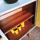 Wooden sideboard in soft green