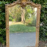 Old Louis XV style mirror in wood and gilded stucco. Napoleon III