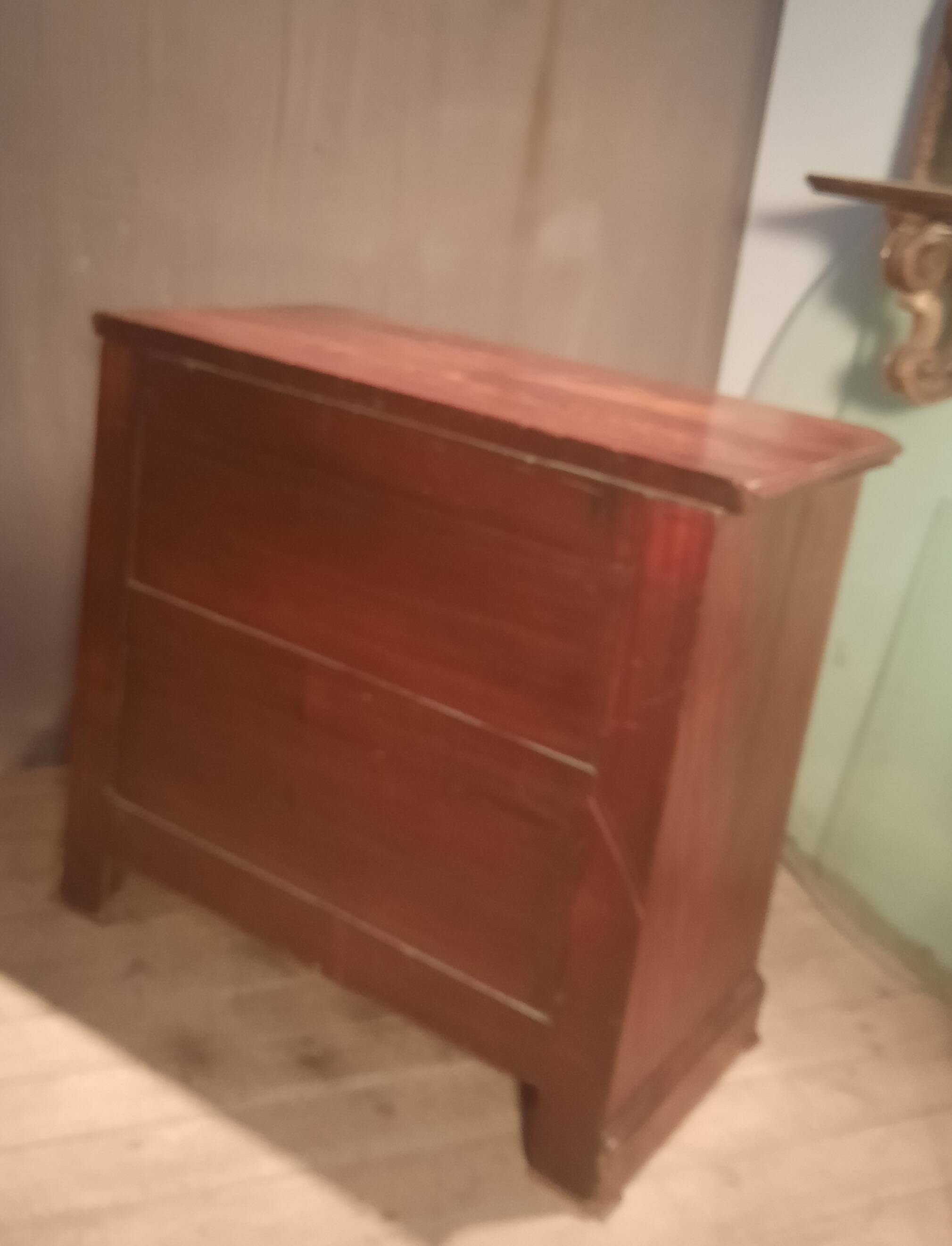 Small Louis Philippe chest of drawers with cut corners.