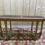 Bench - Piano bench in caning and gilded wood in the Louis XVI style.