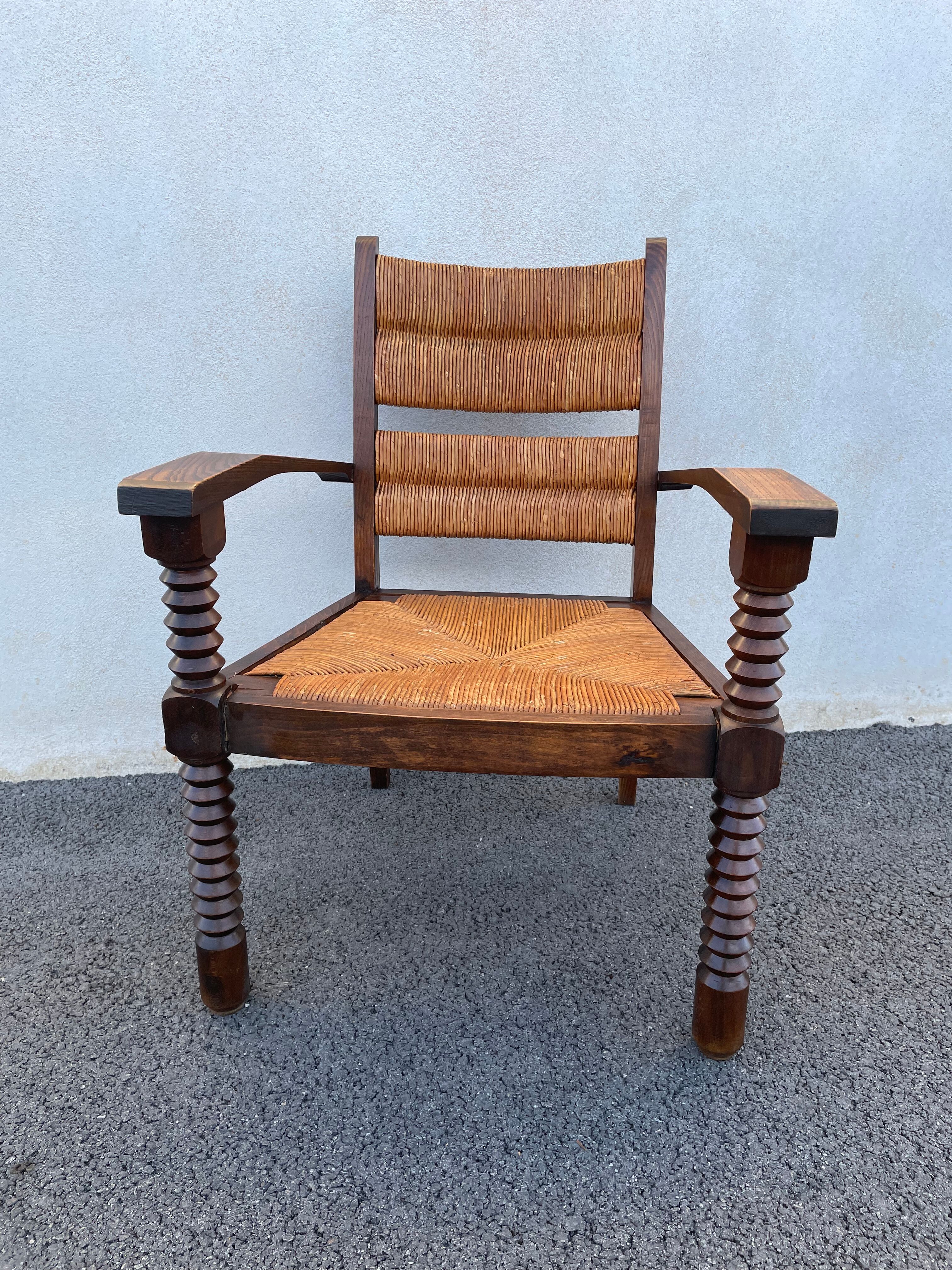 Vintage armchair in straw and brutalist wood