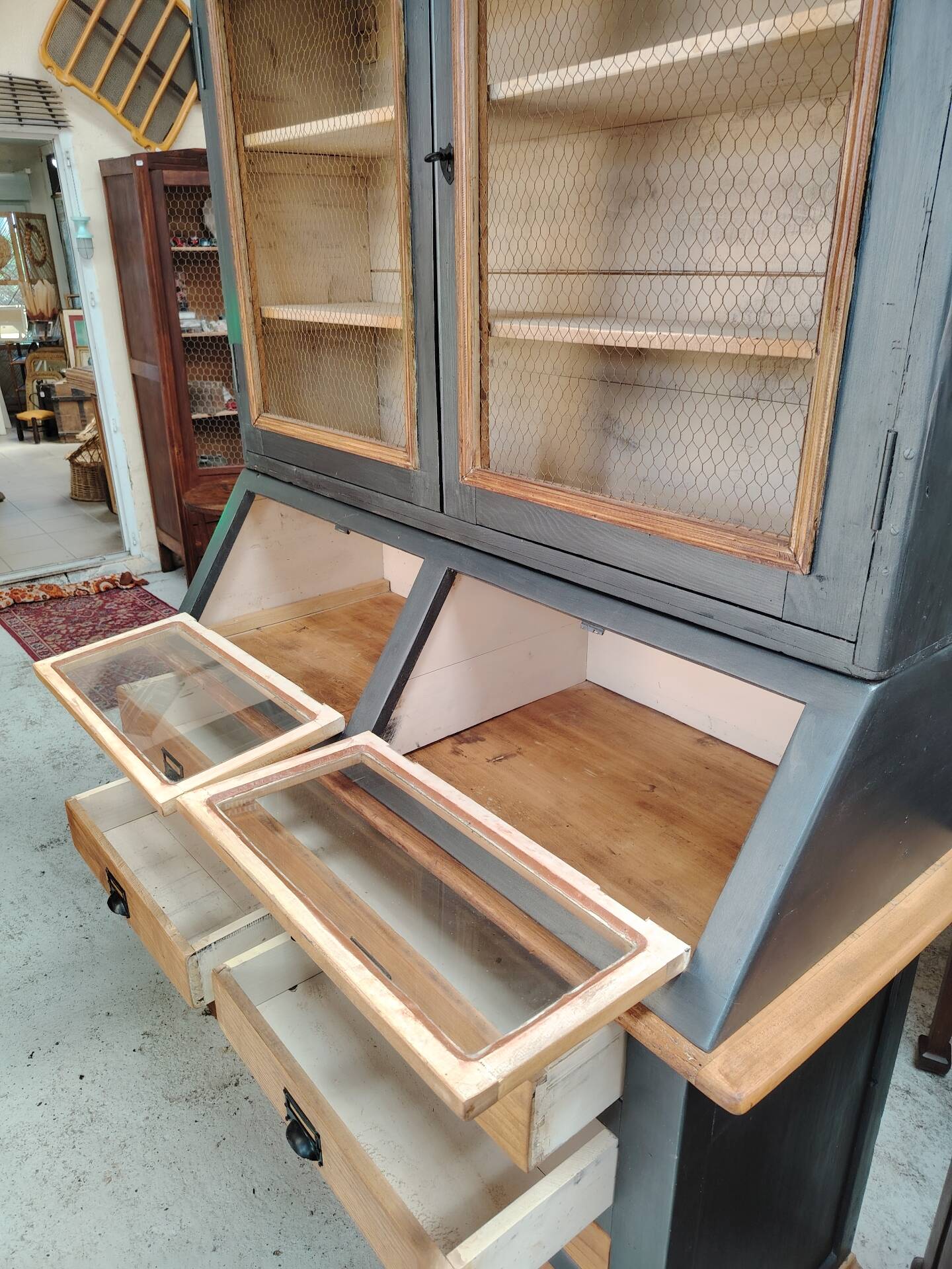 Large two-body grain merchant cabinet made of solid wood.