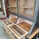 Large two-body grain merchant cabinet made of solid wood.