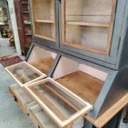Large two-body grain merchant cabinet made of solid wood.