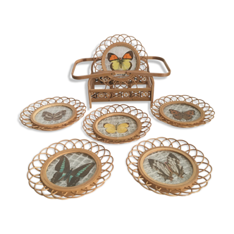 Rattan under glasses with butterflies in bamboo display