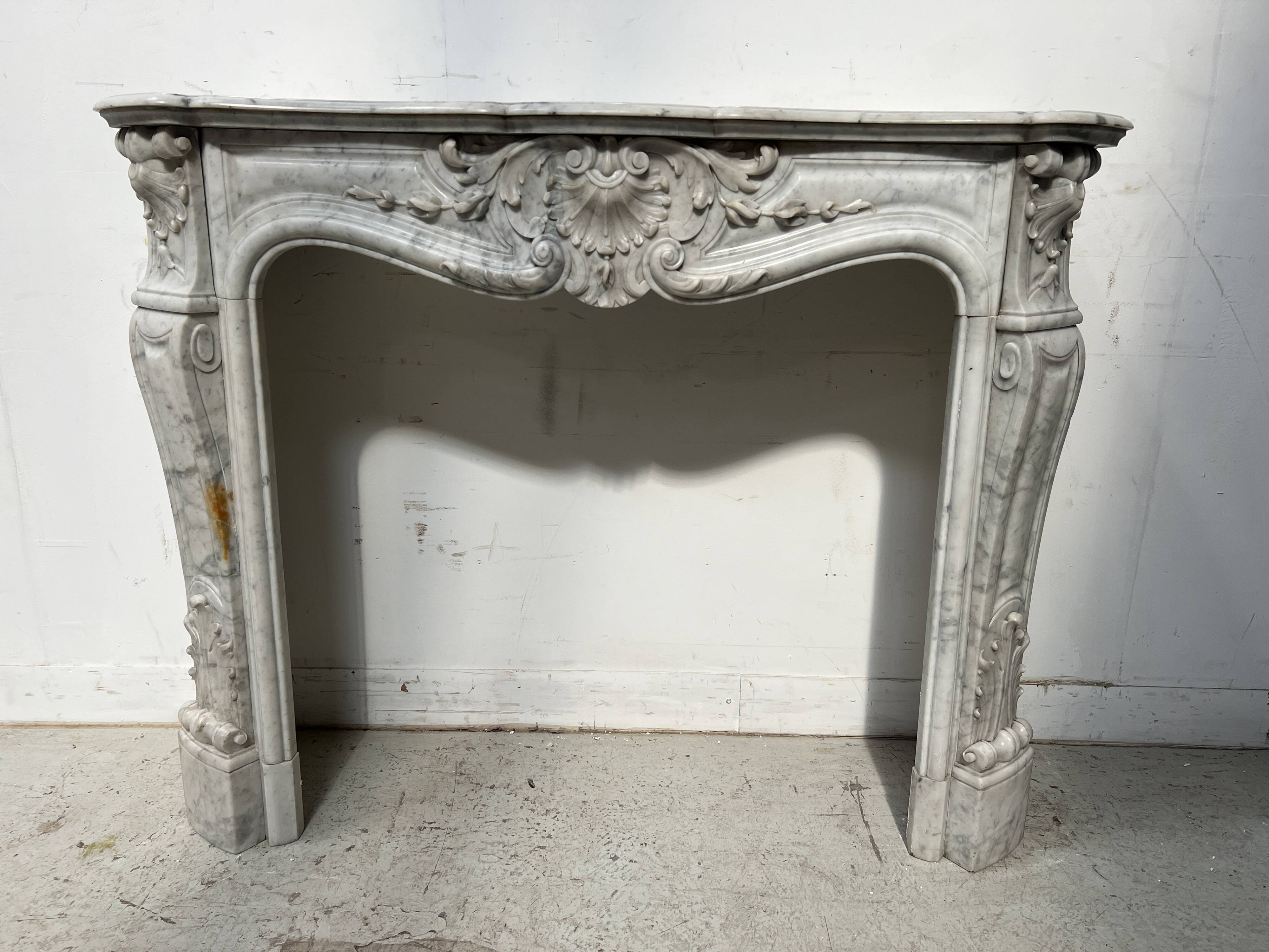 Louis XV style white Carrara marble fireplace, 19th century.