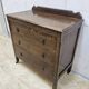 Antique chest of drawers on wheels with wood carving (key top drawer)