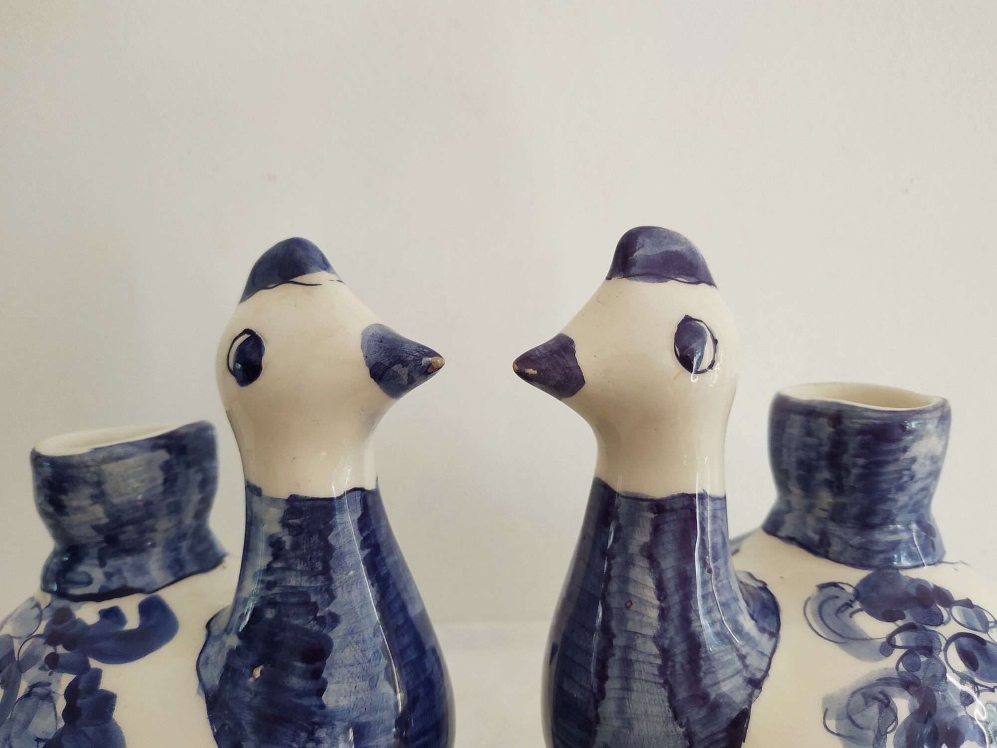 Pair of bird candlesticks in blue white, Skyros earthenware