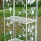 Folding white wrought iron shelf