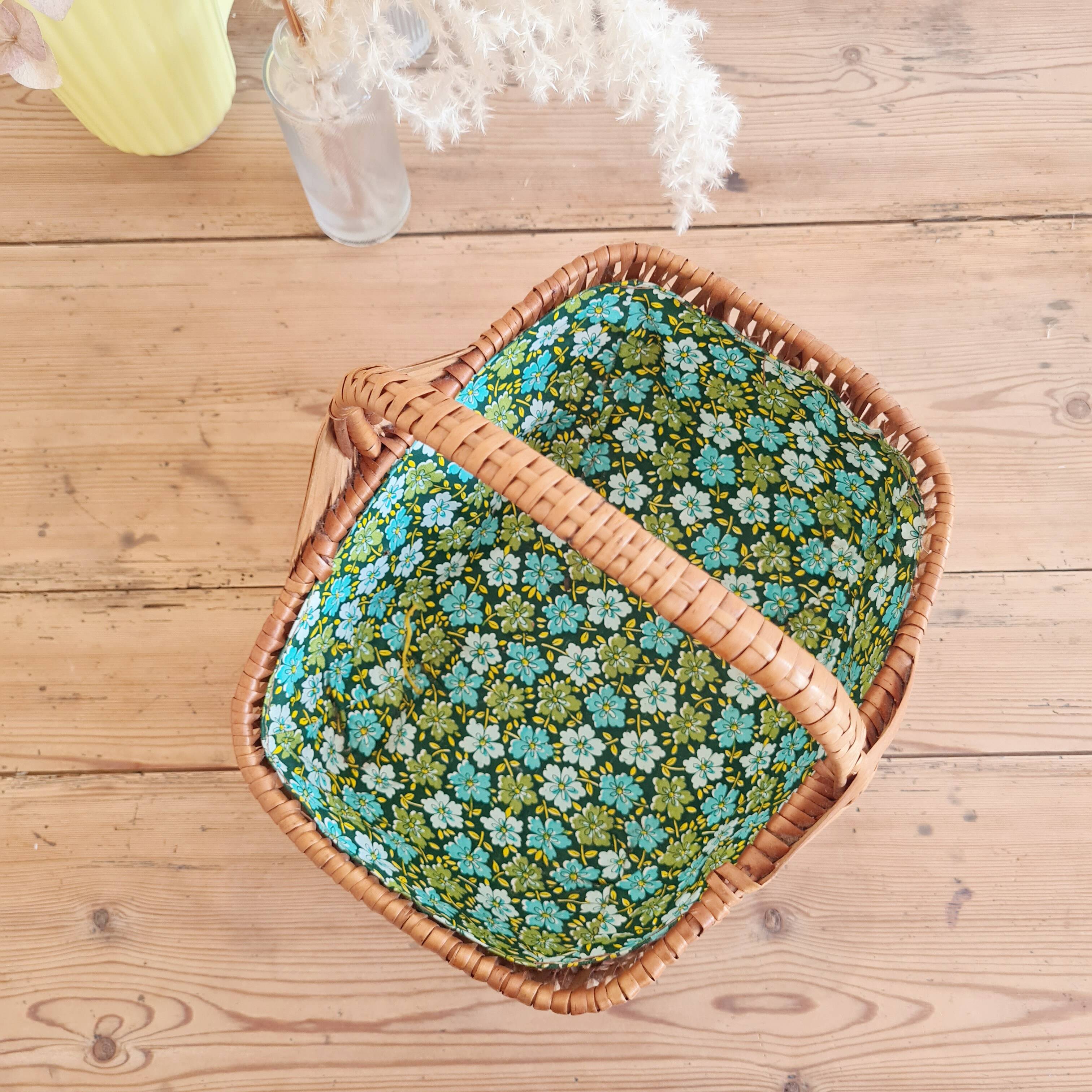 Small old basket with floral fabric interior