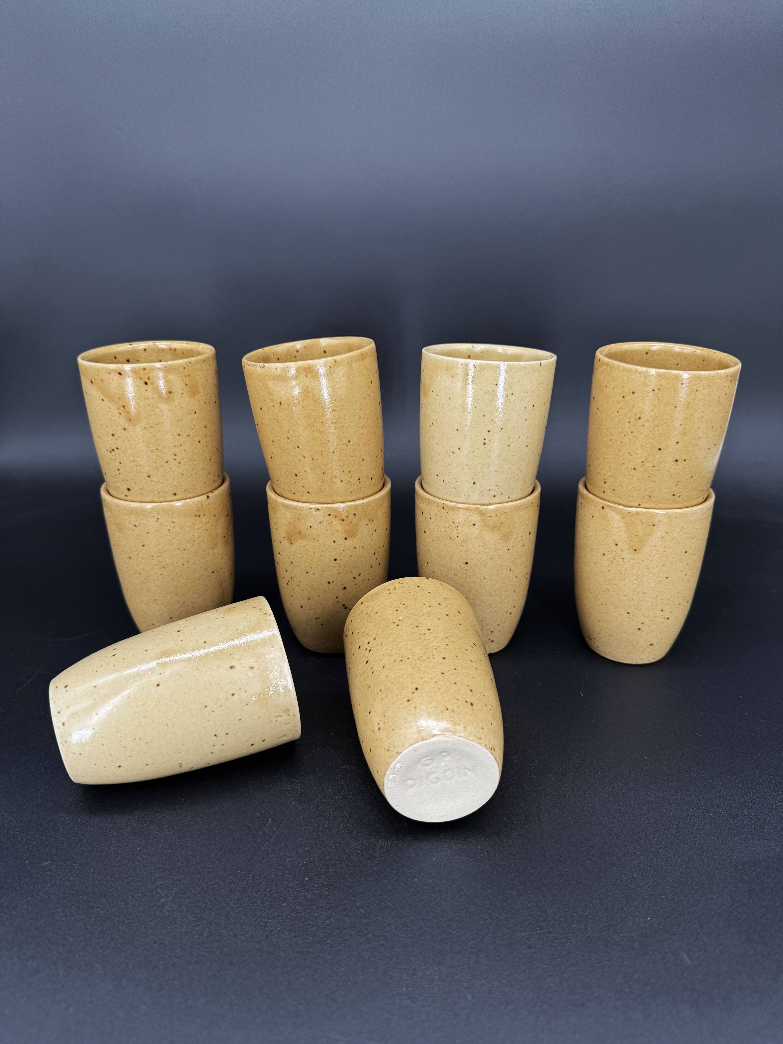 10 glazed stoneware cups signed Digoin
