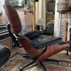 Black leather Eames Vitra armchair, original with rosewood ottoman.