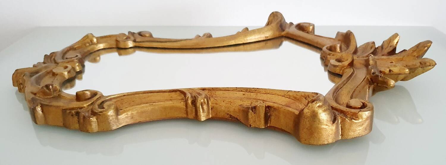 Baroque mirror gilded with gold leaf