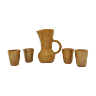 LOt Of 4 Cups And Pitcher In Sandstone.