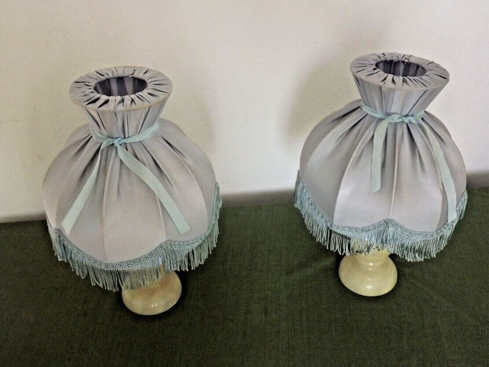 Pair of marble bedside lamps with blue satin fringed shades