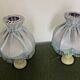 Pair of marble bedside lamps with blue satin fringed shades