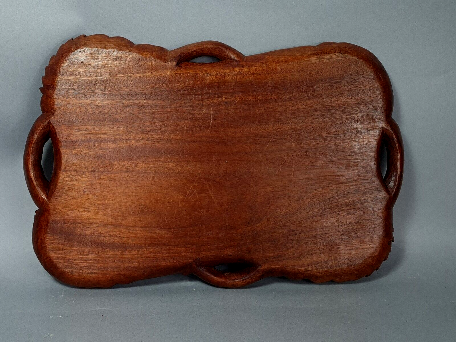 Ancient wooden tray carved with Chinese dragons around 1900