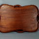 Ancient wooden tray carved with Chinese dragons around 1900