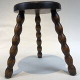 Dark turned wood tripod stool