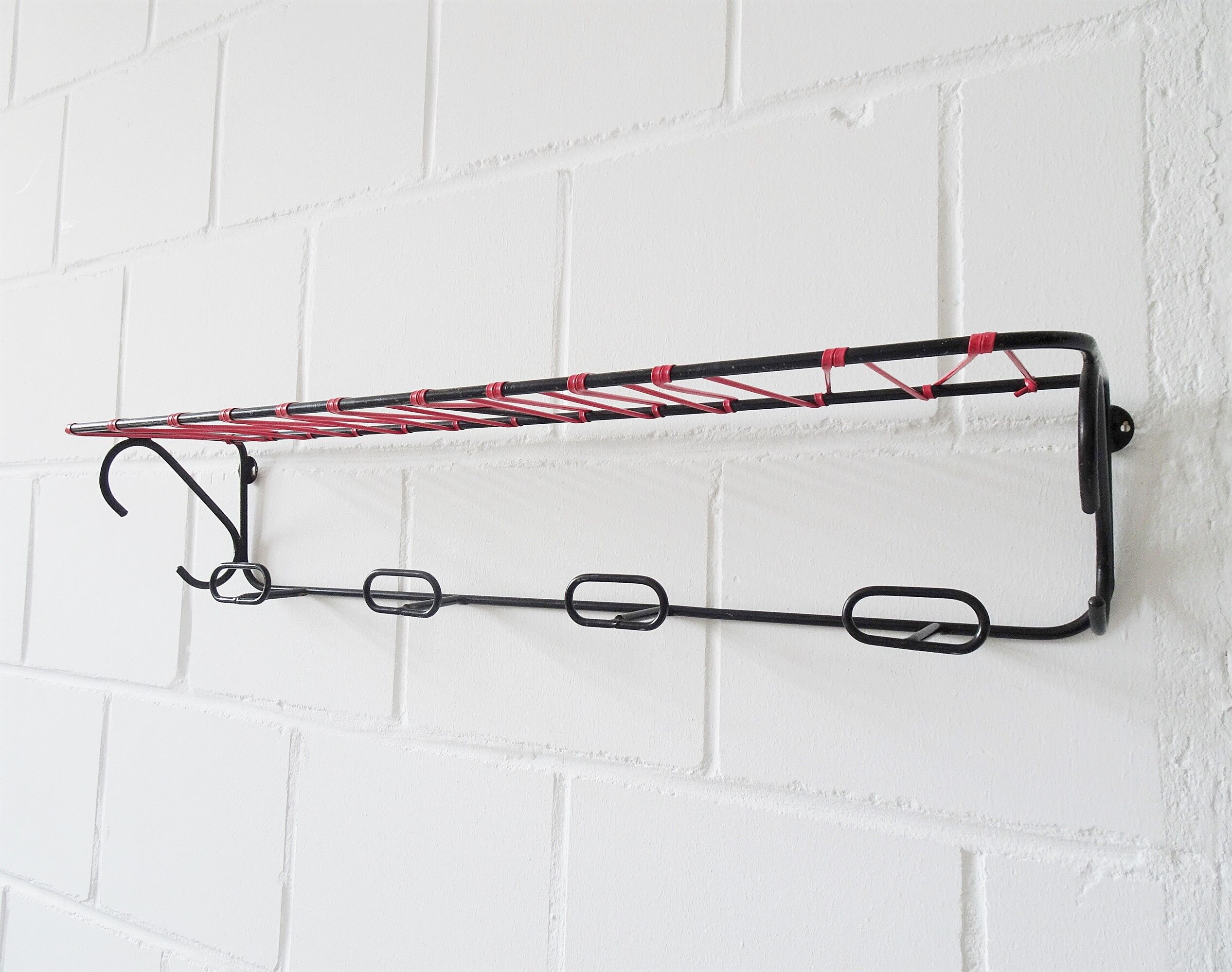 Minimalist wall coat rack in string design in black and red
