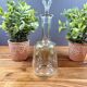 Glass carafe with enamel floral decoration and stopper – vintage